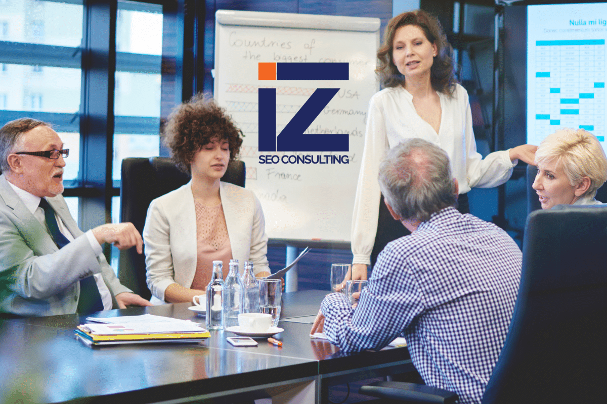 Employees in the enterprise discussing SEO strategy.